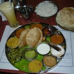 When I first went to India in the 1970s. you could get a decent thali served on a banana leaf for about 25 cents in Tamil Nadu. This upscale South Indian thali is served at Hotel Saravan Bhavan, on Janpath in New Delhi.