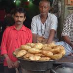 Puris, inflated fried breads, are made and sold by the hundreds in small cafes, like this one in Banares.